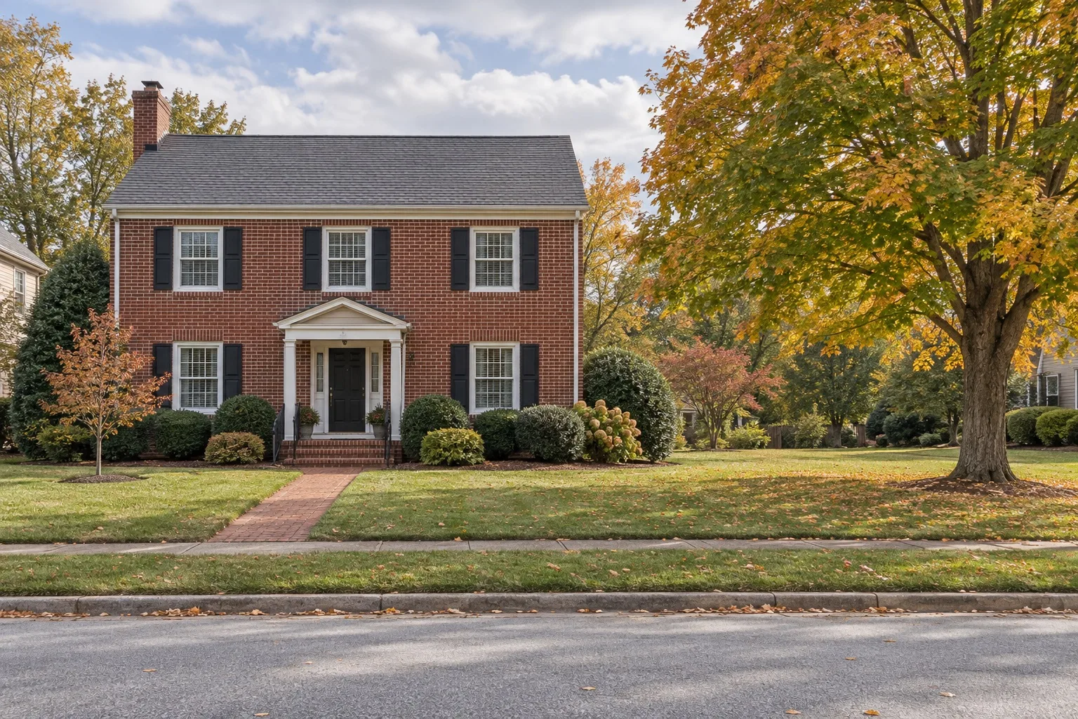 Brick Colonial home with mature trees, ready for radon, mold or well water testing