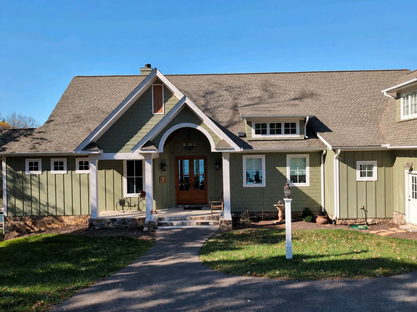 Craftsman-style home near Union Hall, Virginia, with green siding and a covered entrance