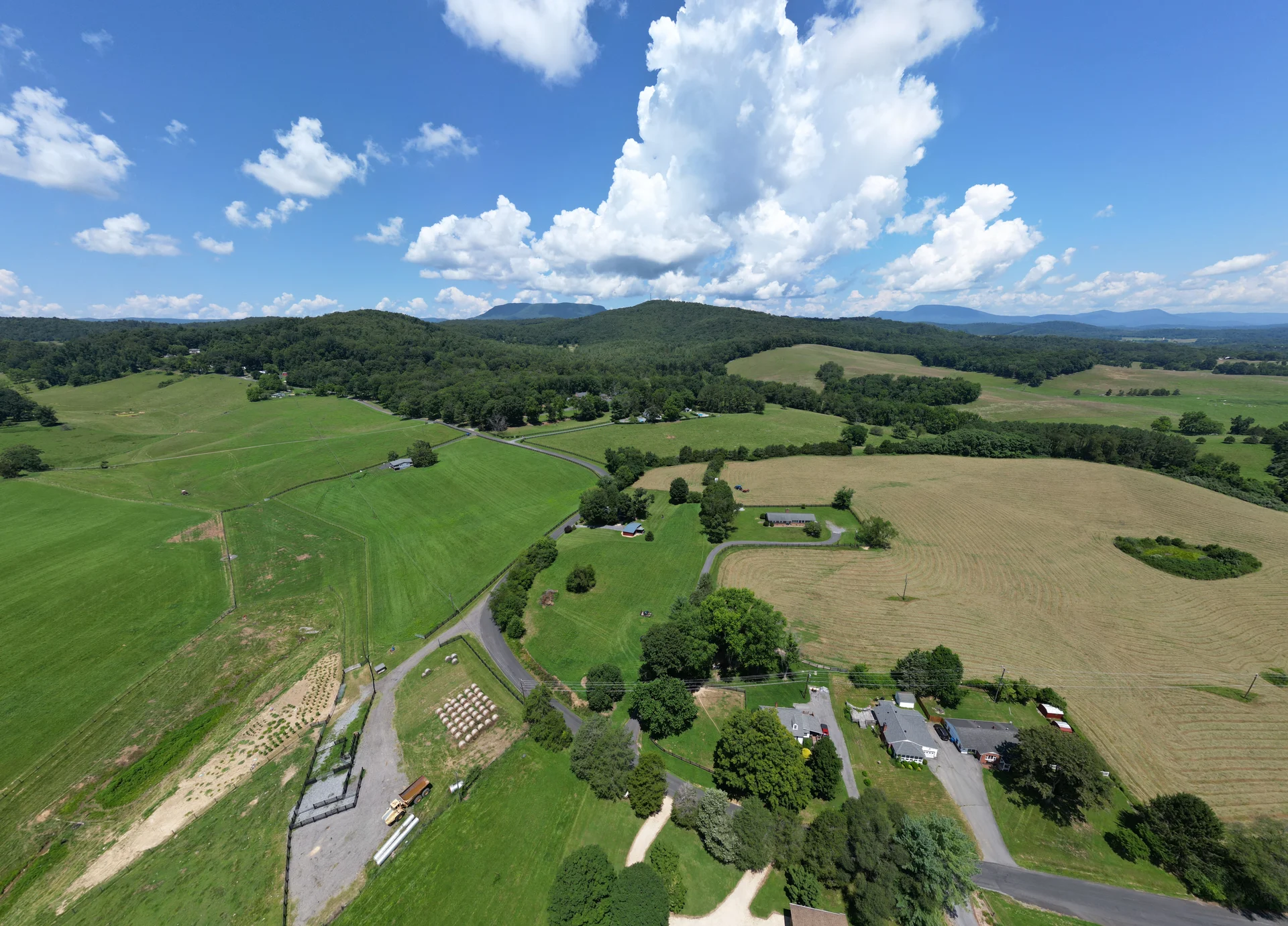 Aerial view of homes, fields and wooded hills in Rockbridge County, Virginia